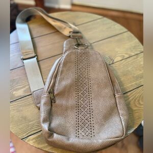 Faux Leather sling bag with a laser-cut pattern design-NWOT